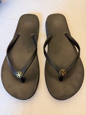 Tory Burch Black Flip Flop Sandals with Gold Logo Medallions